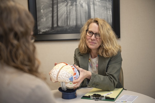 Image of neurology provider talking with patient