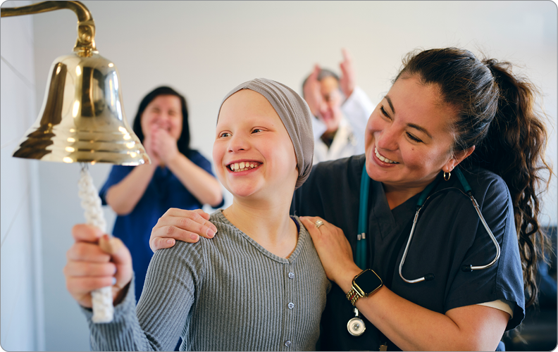 child cancer patient ringing bell