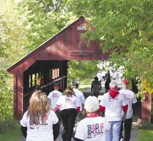 Sixty walkers headed through the covered bridge near Cedar Creek Mall for the Big or Small Walk to benefit the Wausau/Weston Cancer Care Fund at Marshfield Clinic.