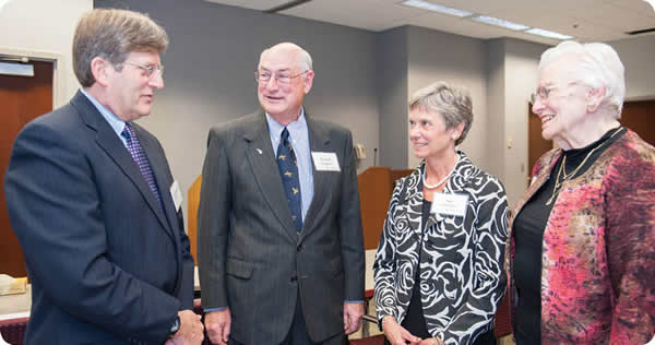 Meeting after the forum were Dr. Douglas Reding (left), Ebenreiter family friend Richard Pamperin, Sue Ebenreiter and Sally Eben