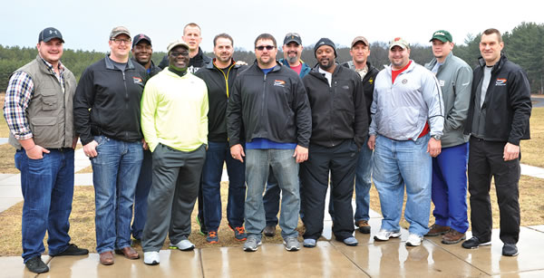 Rich Seubert (front row, center) is surrounded by former NFL players at the trap shoot.