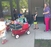 Medford Area Public Schools 2nd graders deliver wagons full of toys to be donated to Marshfield Clinic Pediatric Oncology patients. 