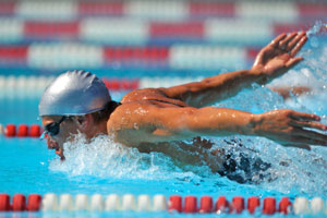 Competitive swimmer doing a butterfly stroke