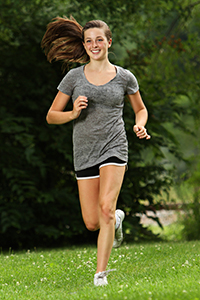 Teenage girl jogging